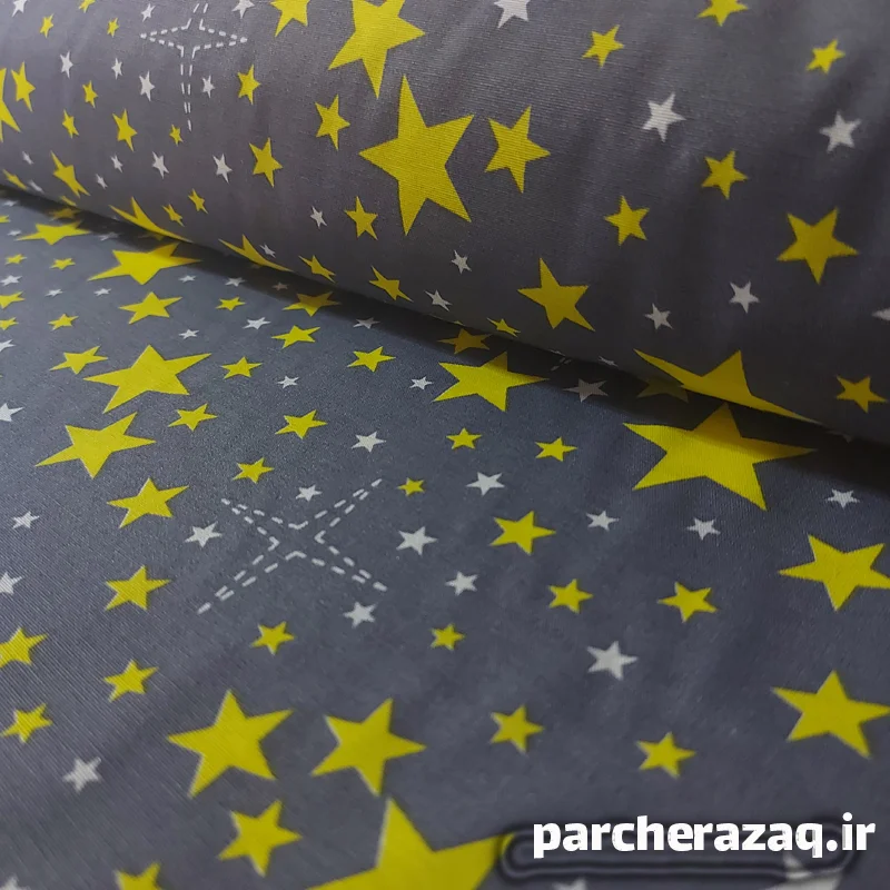 پارچه ملحفه ای تترون طرح ستاره زرد عرض دو متر